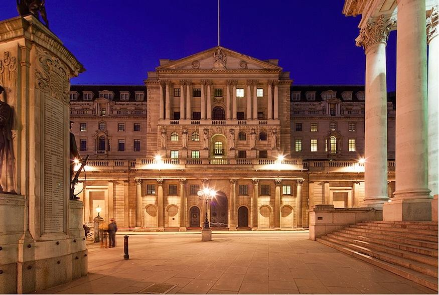Neoclassical banking architecture on Threadneedle Street, City of London, illuminated at dusk